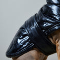 Load image into Gallery viewer, Adjustable waterproof jacket with knit turtleneck and fleece lining. The fleece on the inside keeps your dog warm and comfortable and the knit turtleneck makes the outfit super chic. It is fitted with adjustable velcro straps on the back, black fleece lining for comfort and camel knit turtleneck.