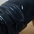 Load image into Gallery viewer, Adjustable waterproof jacket with knit turtleneck and fleece lining. The fleece on the inside keeps your dog warm and comfortable and the knit turtleneck makes the outfit super chic. It is fitted with adjustable velcro straps on the back, black fleece lining for comfort and camel knit turtleneck.
