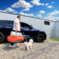Cargar la imagen en la vista de la galería, man carrying an orange car seat for pets