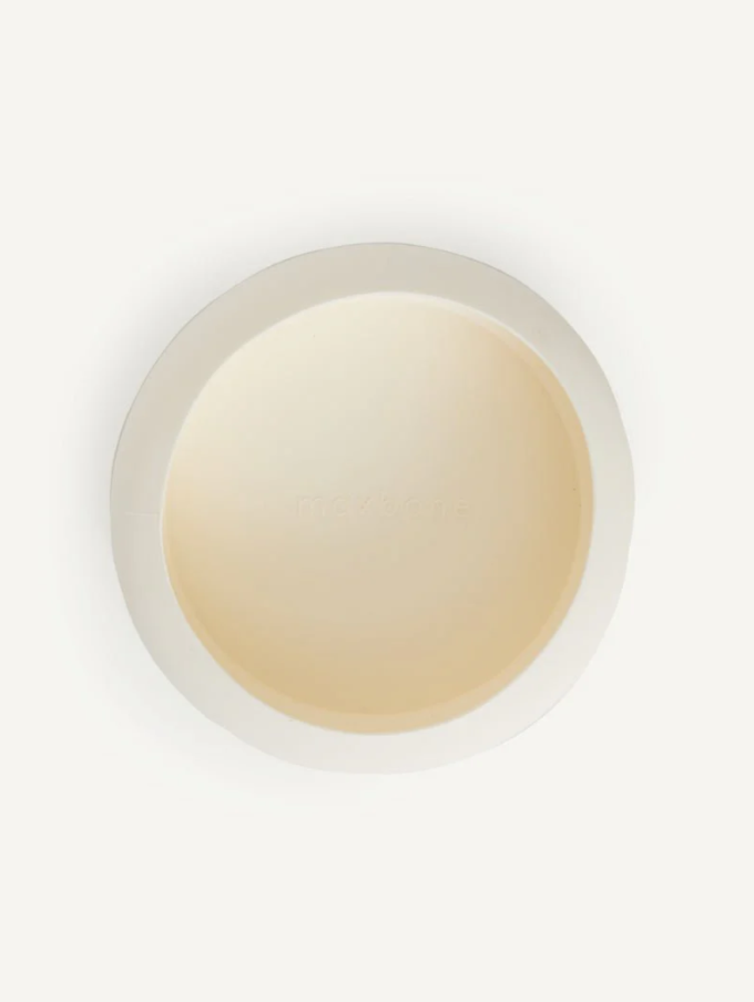 Round beige object on a white background