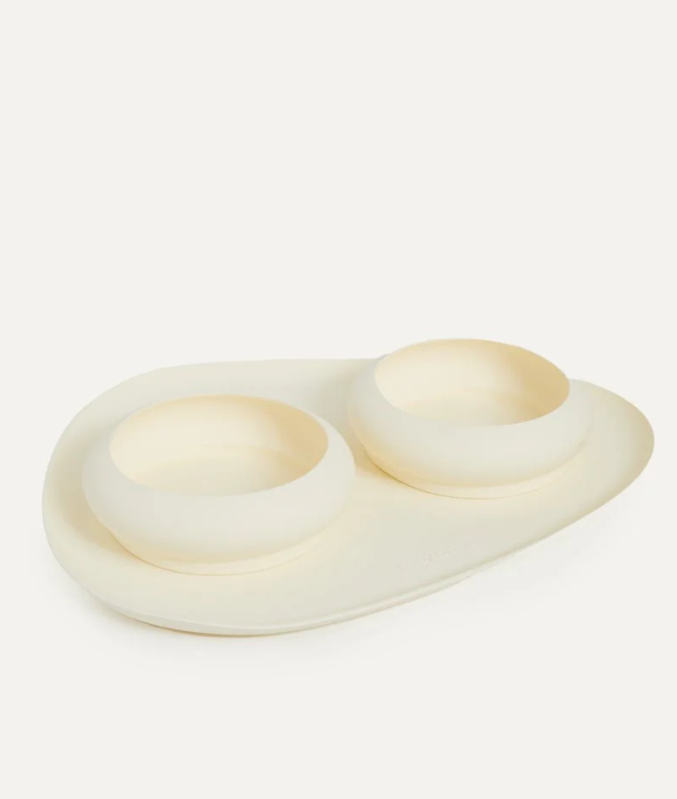 Beige pet bowl and mat silicone set on a white background