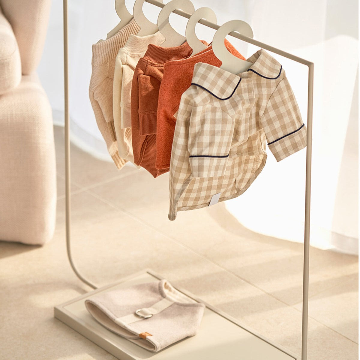 This clothing rack is both aesthetically pleasing and practical with the added bonus of a bottom shelf to store wet tissue and already-folded clothing.