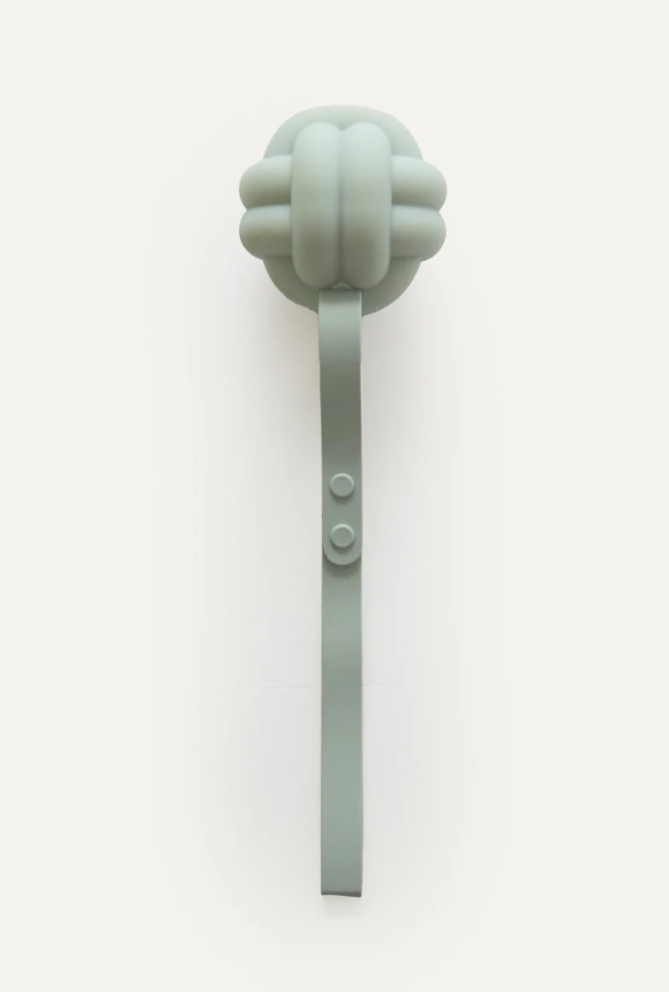 Silicone teething toy with a knot on a white background