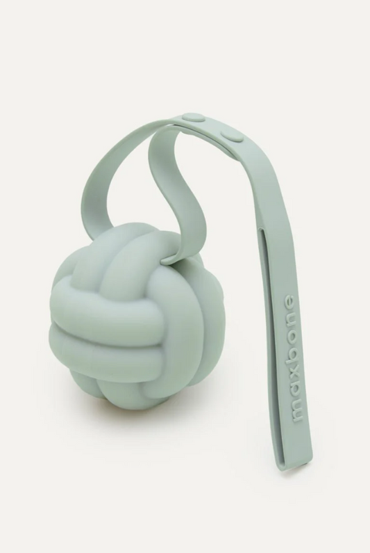 Silicone teething toy with a knot on a white background