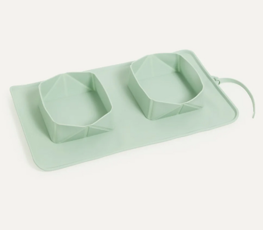 Mint green silicone on the go (travel) pet bowls on a white background