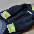 Load image into Gallery viewer, Basic blue heather fleece sweater with ribbed details in beige and neon green stripes on the neckline and cuffs.
