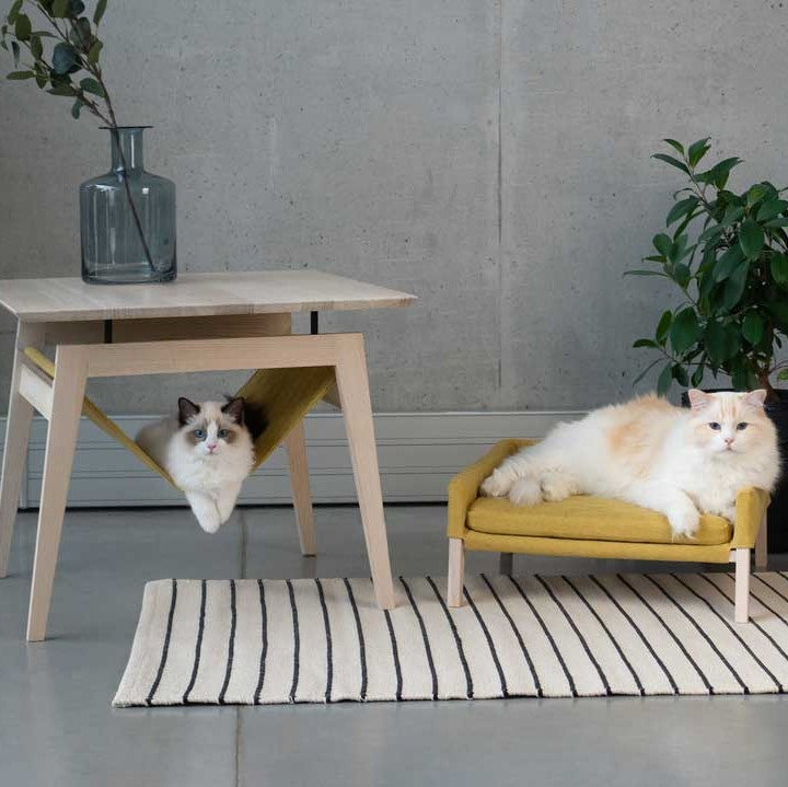 The Kikko is a multifunctional table, combining a coffee table with a comfortable hammock for your cats.