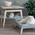 Load image into Gallery viewer, The Kikko is a multifunctional table, combining a coffee table with a comfortable hammock for your cats.
