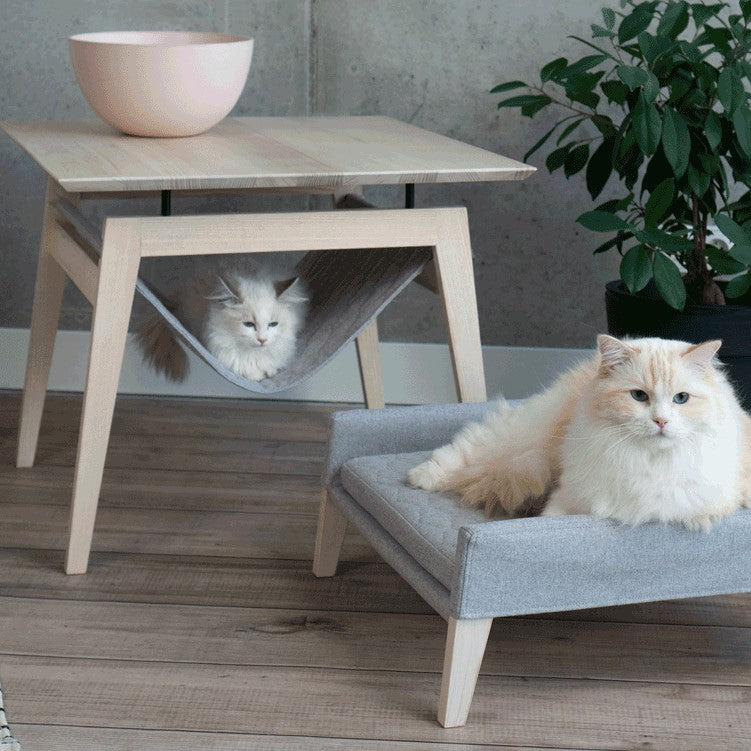 The Kikko is a multifunctional table, combining a coffee table with a comfortable hammock for your cats.