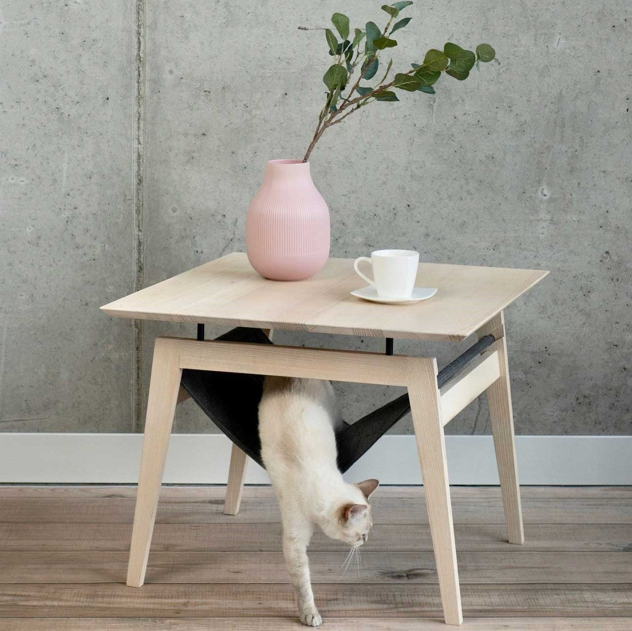 The Kikko is a multifunctional table, combining a coffee table with a comfortable hammock for your cats.