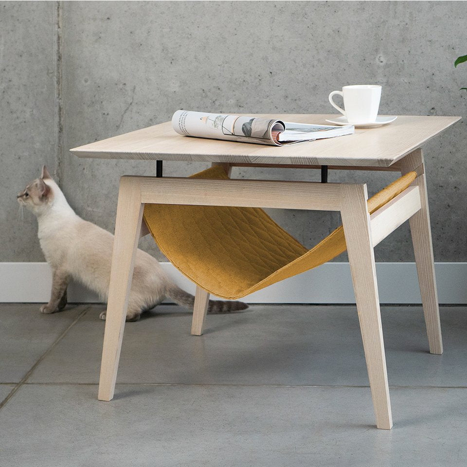 The Kikko is a multifunctional table, combining a coffee table with a comfortable hammock for your cats.