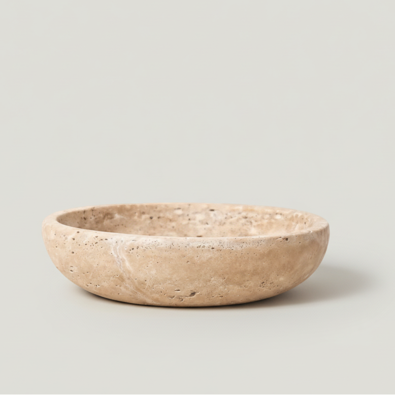 Beige ceramic bowl on a light beige background