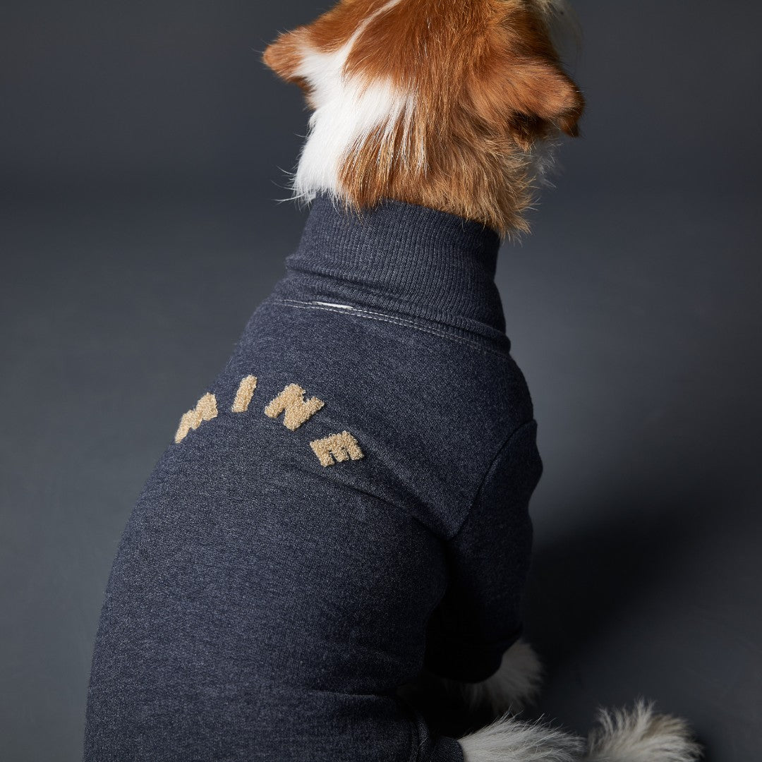 Basic blue heather fleece turtleneck sweater with ribbed details and MINE in sand color embroidery on the back