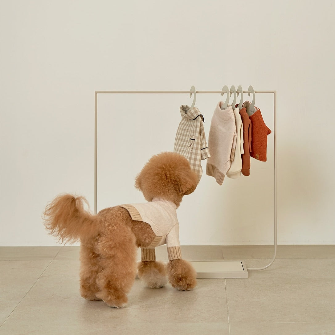 This clothing rack is both aesthetically pleasing and practical with the added bonus of a bottom shelf to store wet tissue and already-folded clothing.