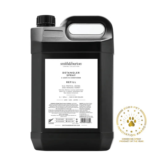 Black detangler spray refill bottle with label on a white background