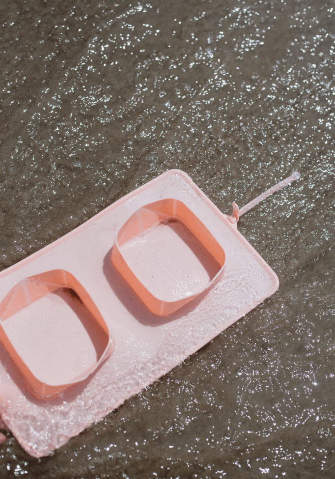 Pink green silicone on the go (travel) pet bowls on a white background