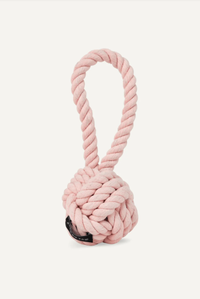 Pink rope knot dog toy on a white background