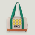 Cargar la imagen en la vista de la galería, Smiley Dog Carrier. Crafted from 100% cotton canvas and designed with comfort, safety and convenience in mind, this chic carrier allows you to enjoy easy, stress-free outings with your pet.
