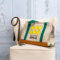 Load image into Gallery viewer, Smiley Dog Carrier. Crafted from 100% cotton canvas and designed with comfort, safety and convenience in mind, this chic carrier allows you to enjoy easy, stress-free outings with your pet.
