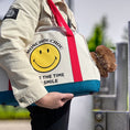 Load image into Gallery viewer, Smiley Dog Carrier. Crafted from 100% cotton canvas and designed with comfort, safety and convenience in mind, this chic carrier allows you to enjoy easy, stress-free outings with your pet.
