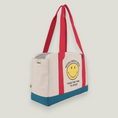 Cargar la imagen en la vista de la galería, Smiley Dog Carrier. Crafted from 100% cotton canvas and designed with comfort, safety and convenience in mind, this chic carrier allows you to enjoy easy, stress-free outings with your pet.
