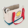 Cargar la imagen en la vista de la galería, Smiley Dog Carrier. Crafted from 100% cotton canvas and designed with comfort, safety and convenience in mind, this chic carrier allows you to enjoy easy, stress-free outings with your pet.
