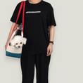 Load image into Gallery viewer, Smiley Dog Carrier. Crafted from 100% cotton canvas and designed with comfort, safety and convenience in mind, this chic carrier allows you to enjoy easy, stress-free outings with your pet.
