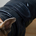 Load image into Gallery viewer, Adjustable waterproof jacket with knit turtleneck and fleece lining. The fleece on the inside keeps your dog warm and comfortable and the knit turtleneck makes the outfit super chic. It is fitted with adjustable velcro straps on the back, black fleece lining for comfort and camel knit turtleneck.
