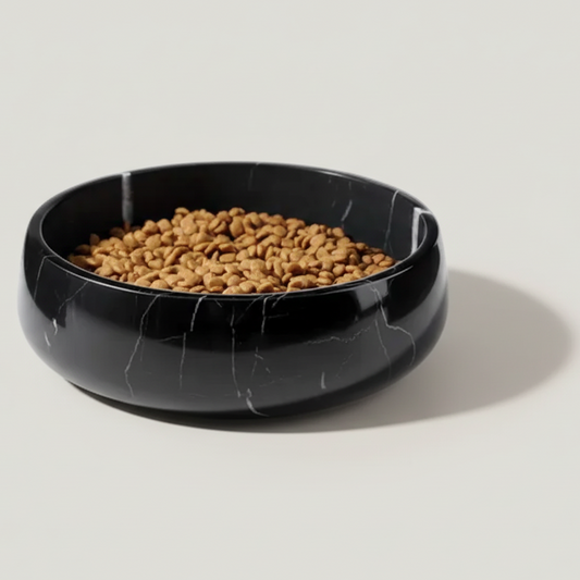 Black marble-patterned pet bowl filled with kibble