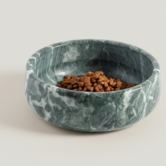 Marble-patterned pet bowl with pet food on a white background